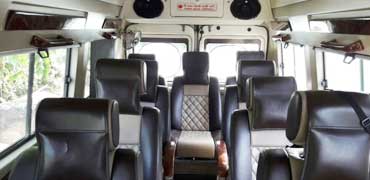 9 seater deluxe 1x1 tempo traveller hire in ahmedabad